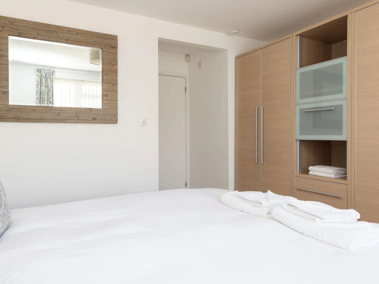 Spacious master bedroom with built-in wardrobes