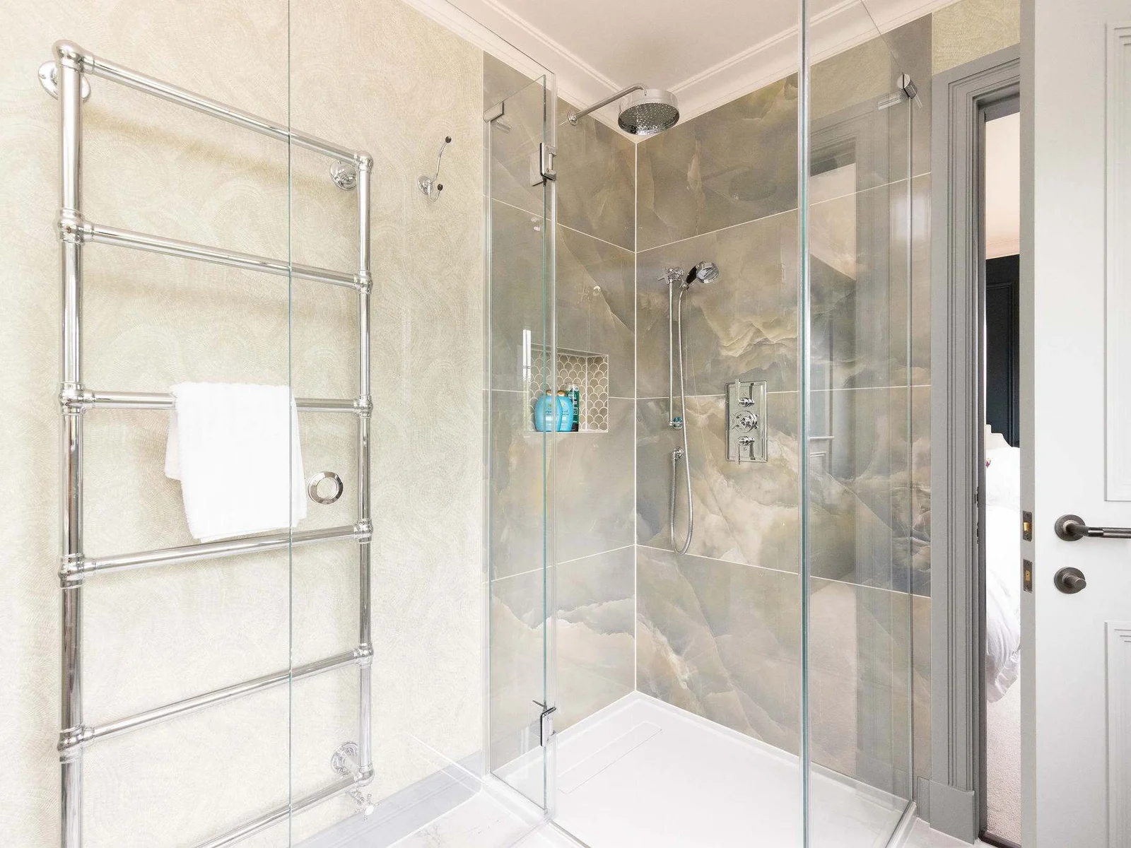 Modern shower with rainfall head and stone-effect tiles