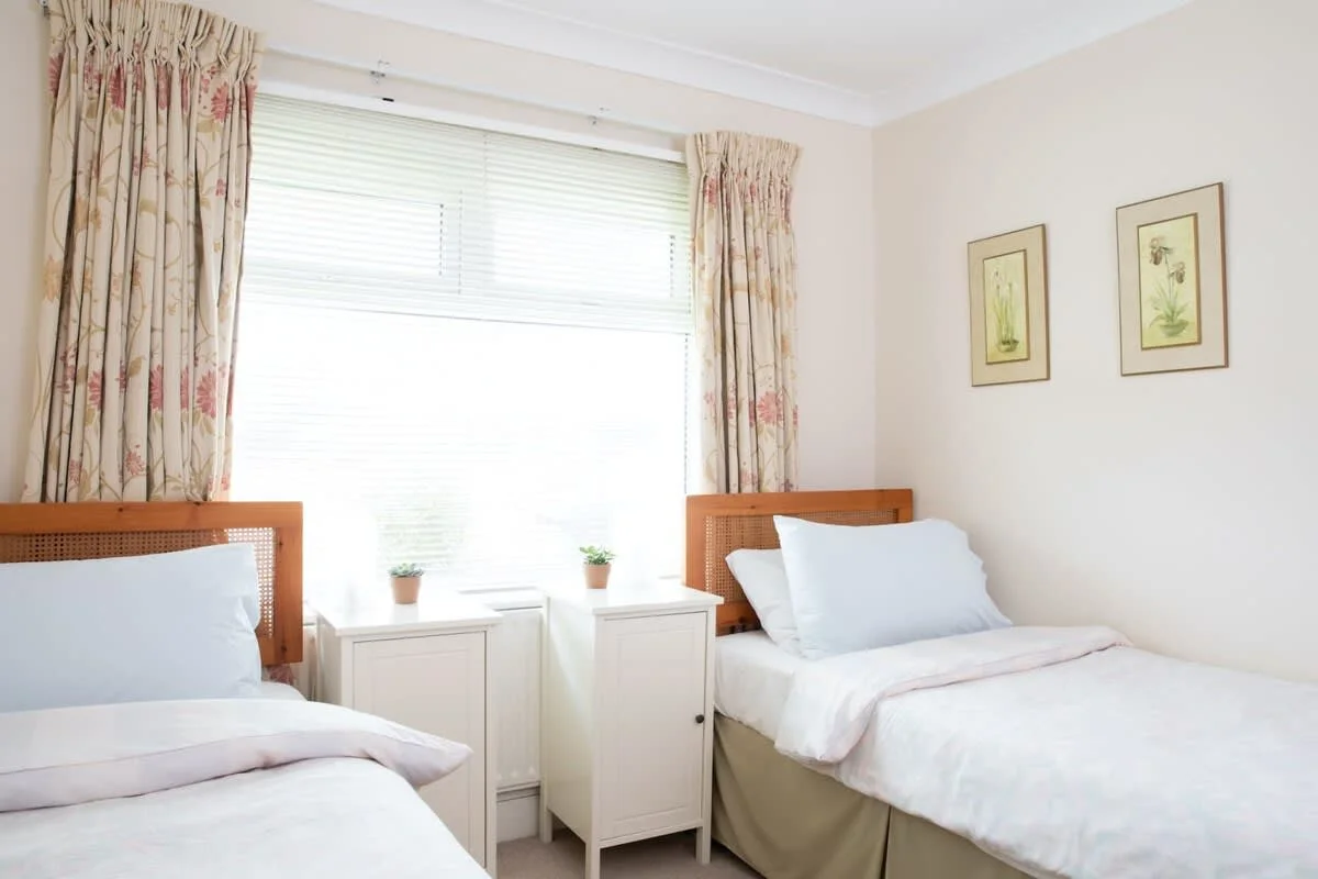 Downstairs twin bedroom with bathroom opposite