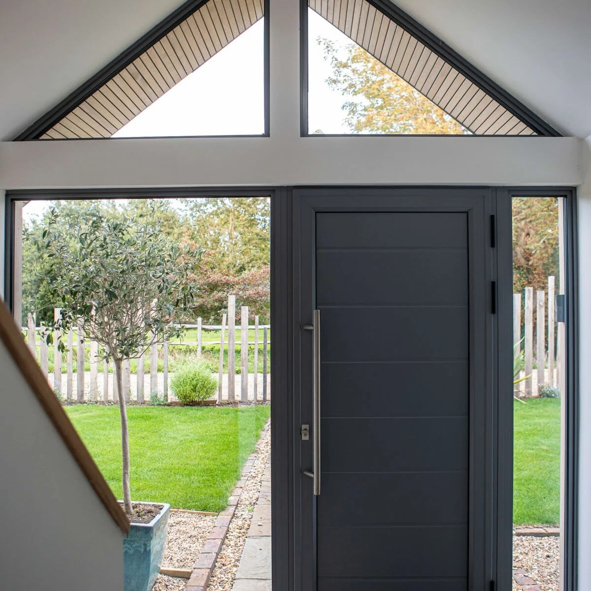 Large glass surfaces allow for plenty of natural light to shine upon both floors of this luxurious home
