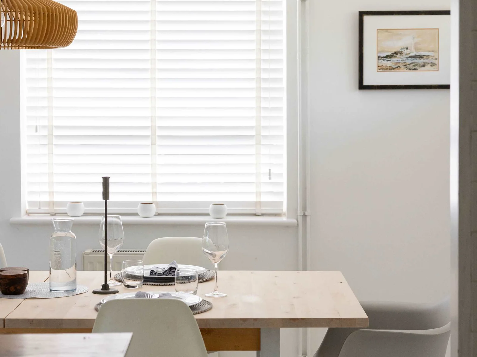 A bright dining space for slow breakfasts and evening drinks