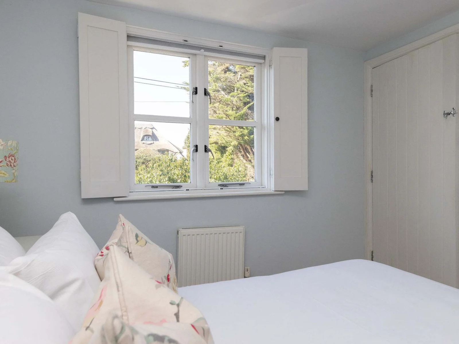 Light-filled bedroom with peaceful outlook