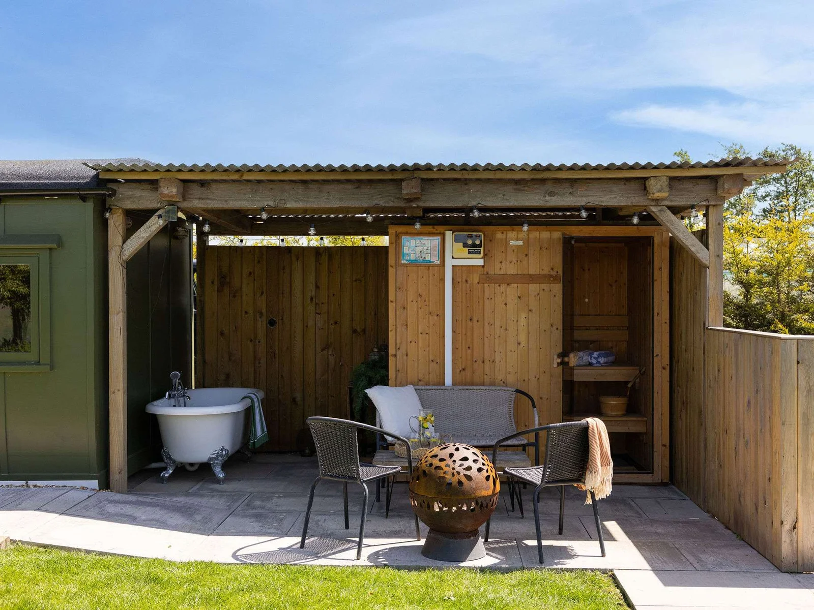 Outdoor relaxation at its best. Our WW2 train carriage comes with a private patio and a charming outdoor bathtub for a refreshing soak and sauna!