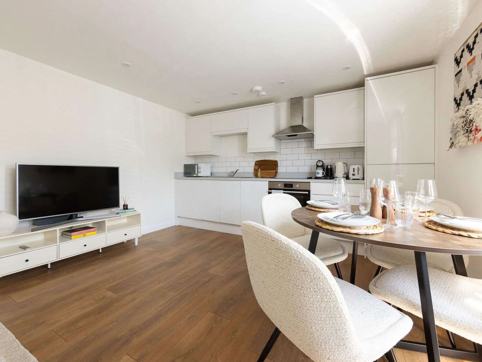 Contemporary kitchen and dining area with Smart TV, ideal for relaxing after exploring Chichester.