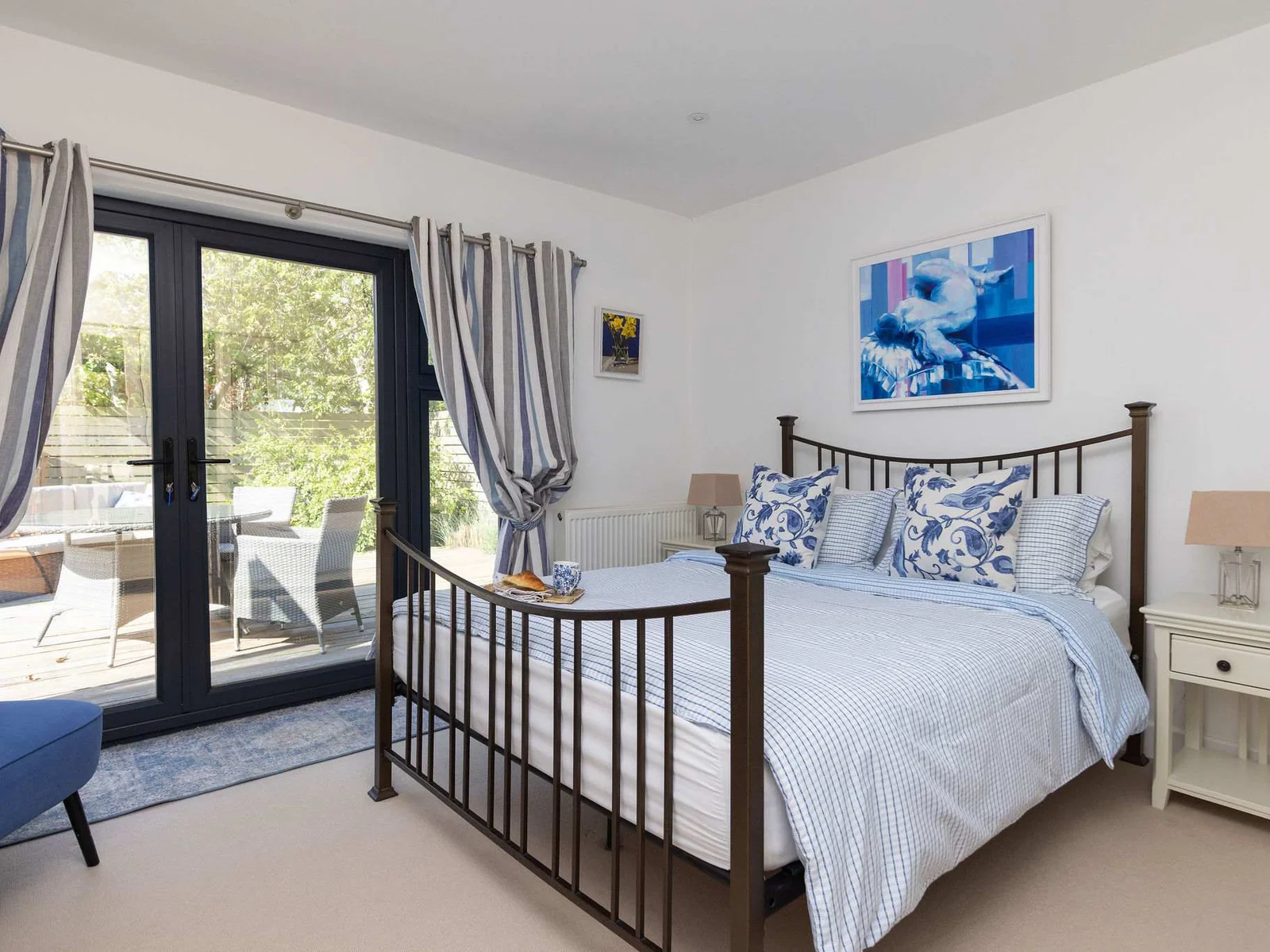 The master bedroom offers a comfortable king-size bed and direct access to your private patio.