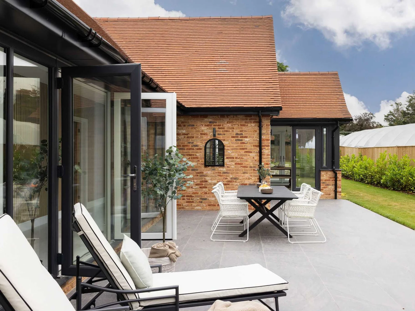 Private patio with outdoor seating and comfortable sunloungers