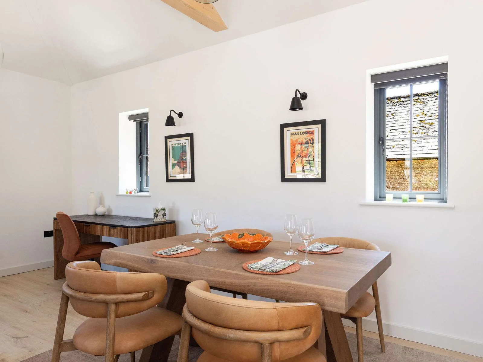 Enjoy slow dinners in a bright dining space with soft light, simple style, and countryside calm.
