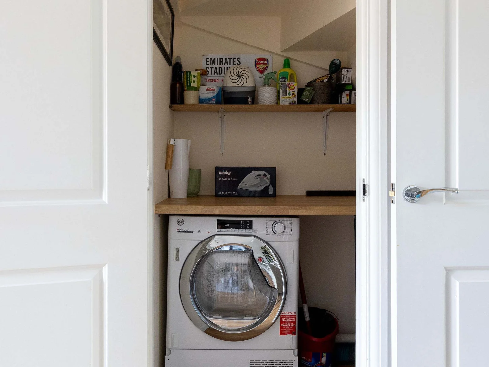 Convenient utility nook with tumble dryer.