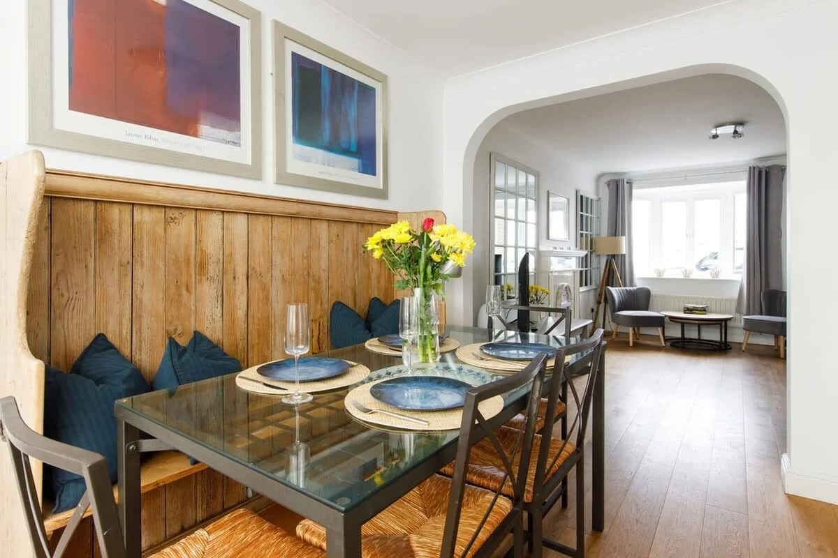 The dining table has beautiful bench seating.