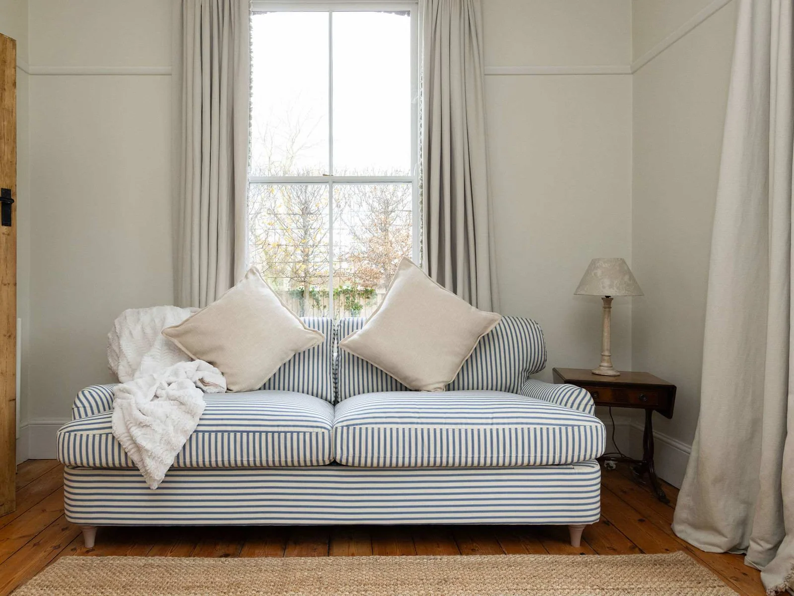 Comfortable seating nook with a calm countryside feel.