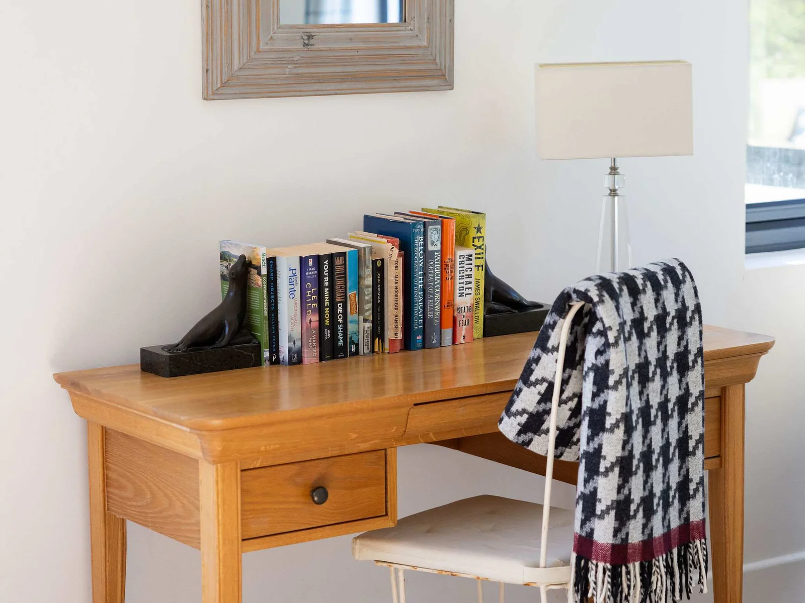 A charming and well-appointed desk area, perfect for reading or working.