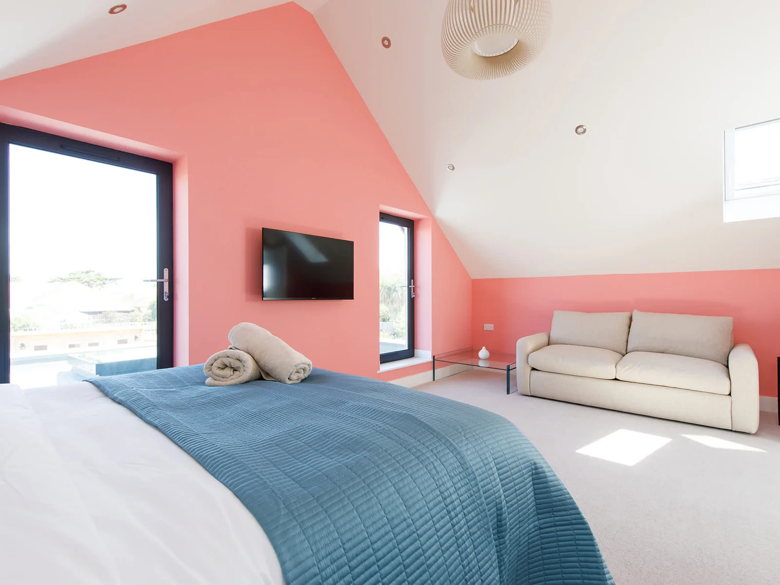 The suite has two Juliet balconies. Open the doors and let the sea breeze in.