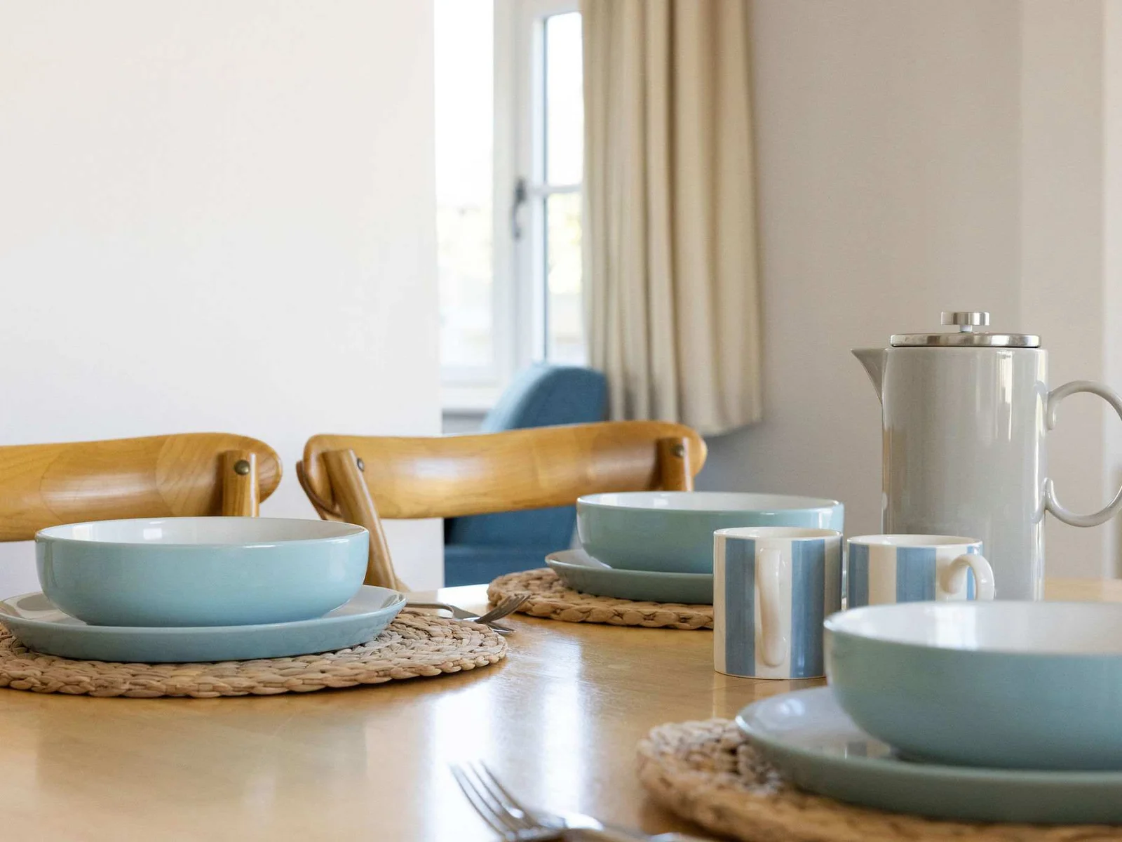 Plenty of plates and cutlery for guests.