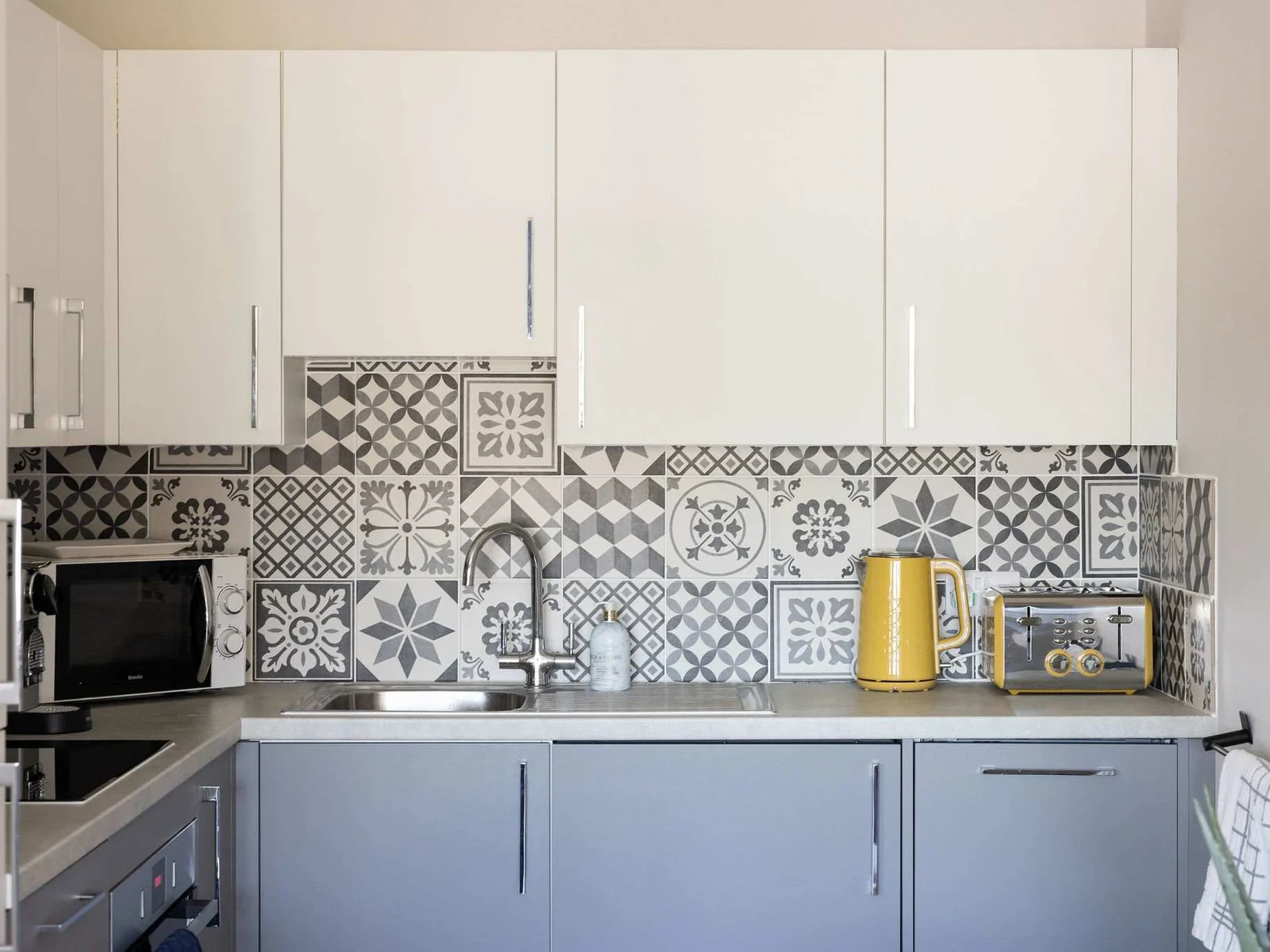 Stylish fully equipped kitchen with modern finishes, ideal for effortless self-catering seaside stays