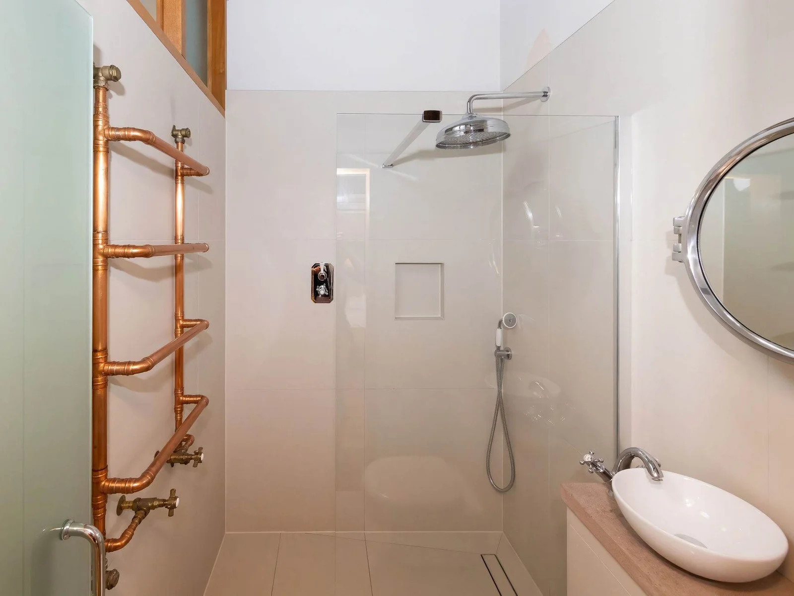 A spacious walk-in rainfall shower — perfect for refreshing after a day exploring.