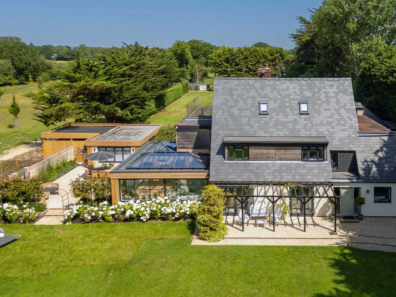 Aerial view of the secluded holiday home with landscaped gardens and generous outdoor living spaces