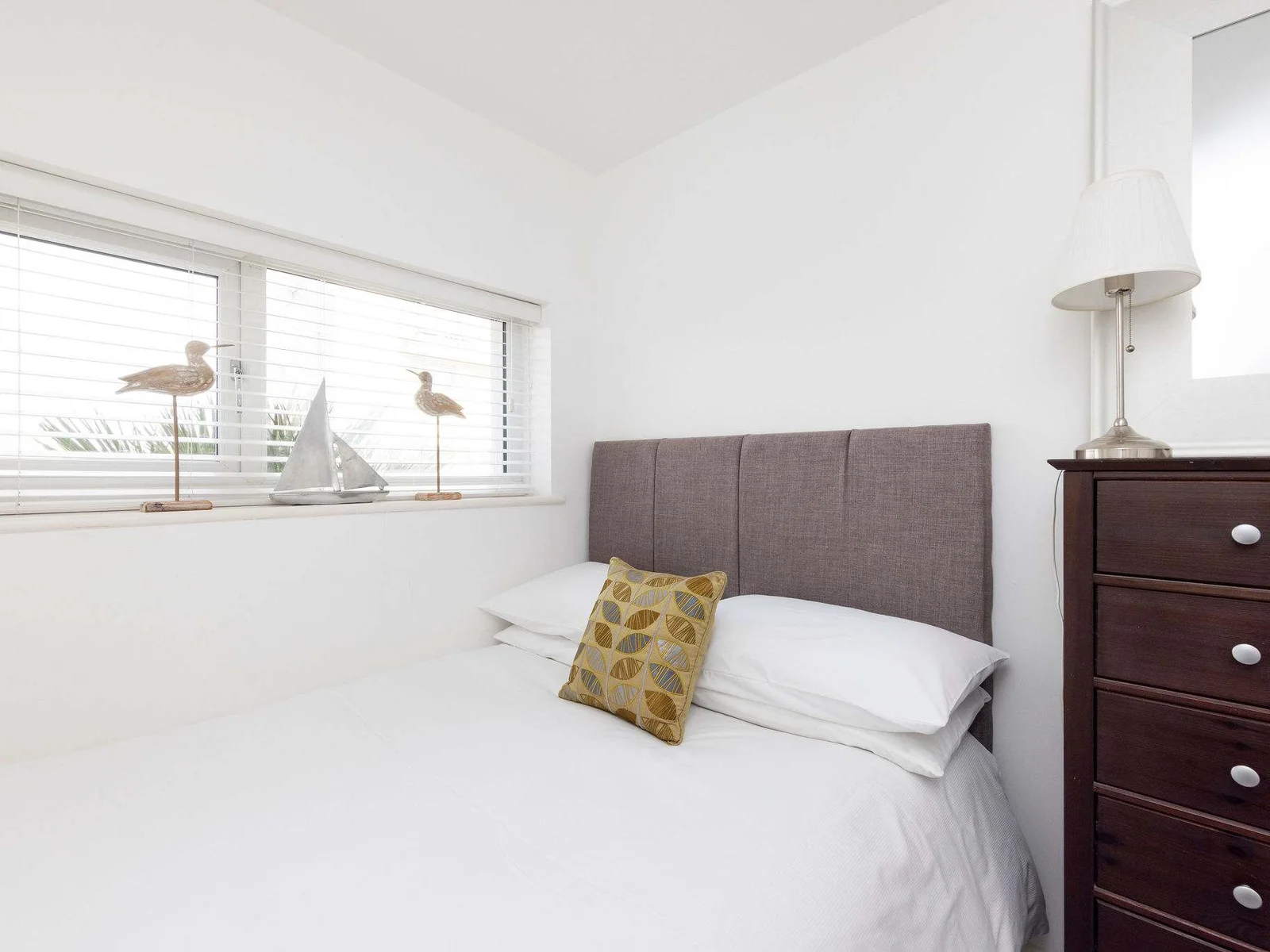 Bedside reading lamp and chest of drawers for your convenience!
