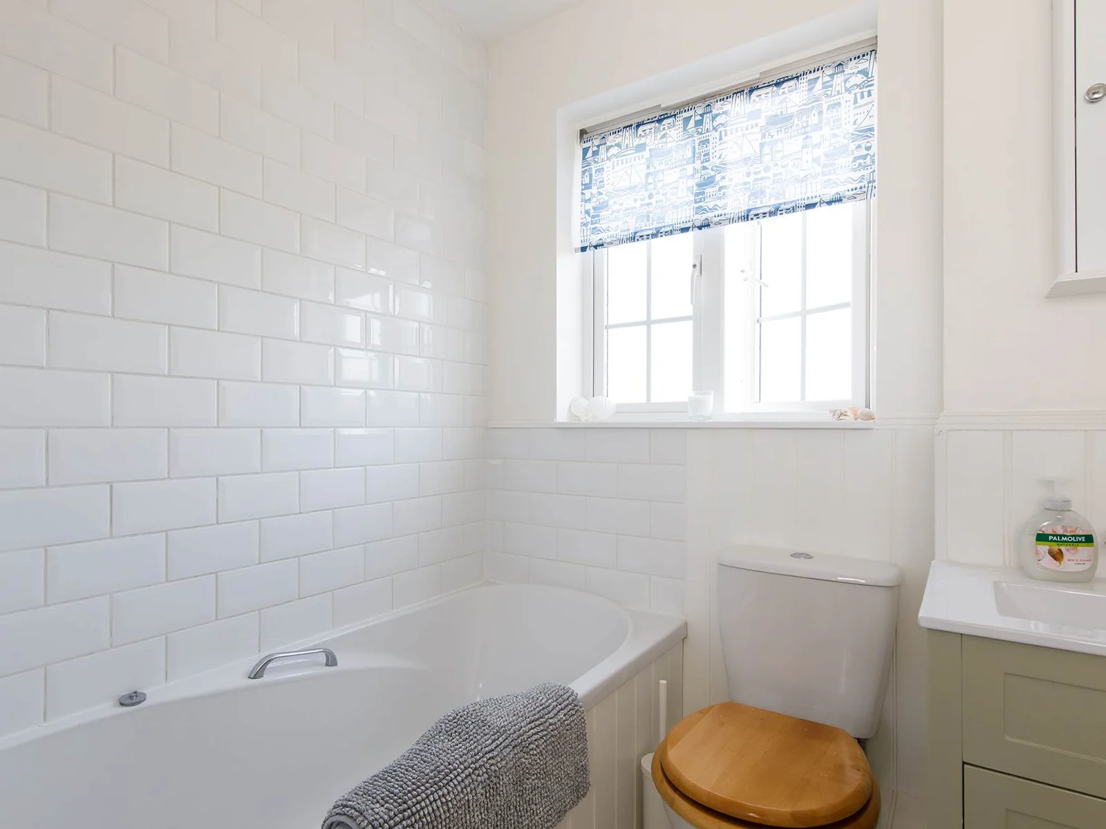Freshen up in the family bathroom after a day at the beach.