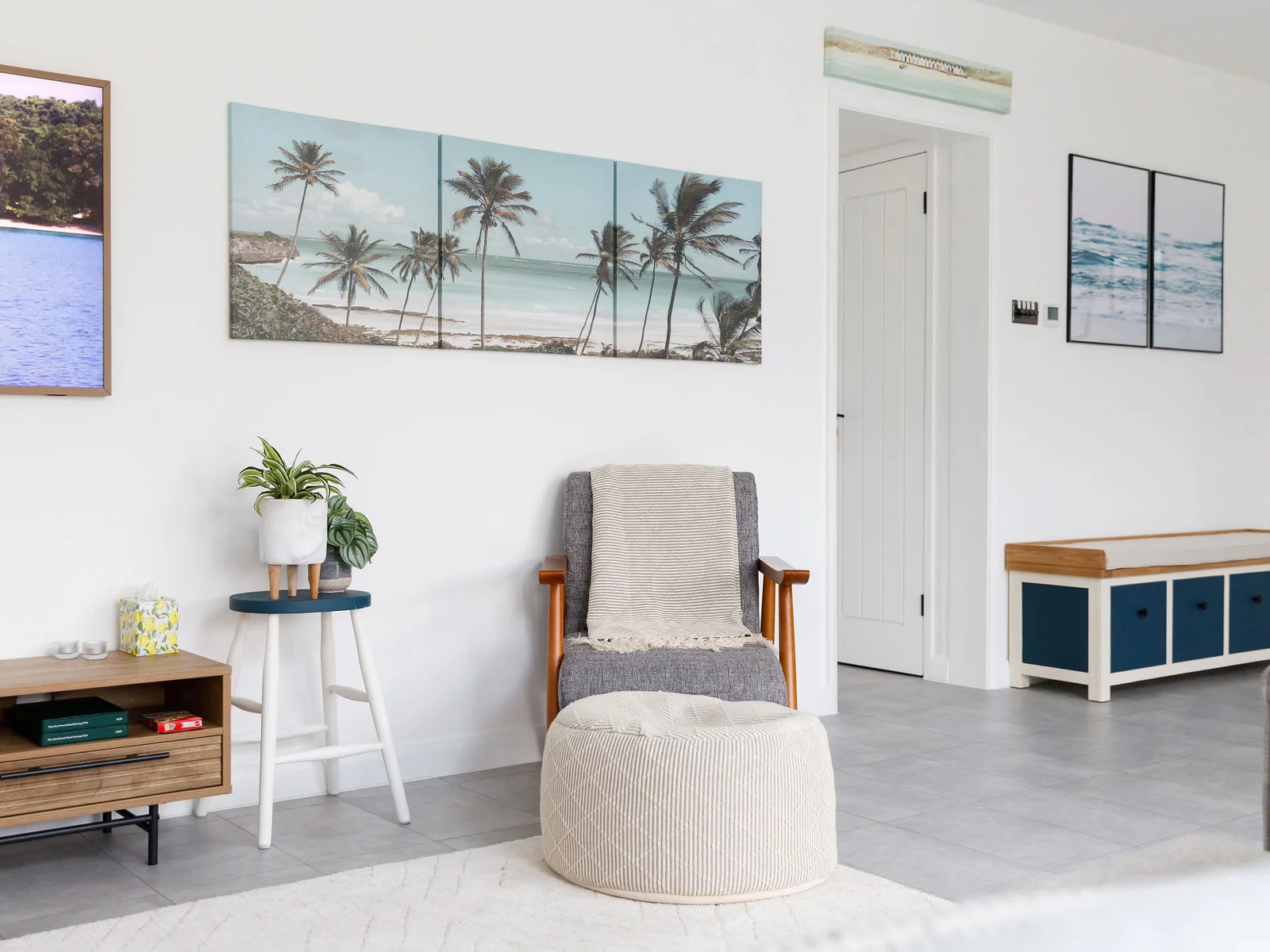 Modern art and coastal tones give the home a fresh and inviting feel, with comfortable furniture for ultimate relaxation.