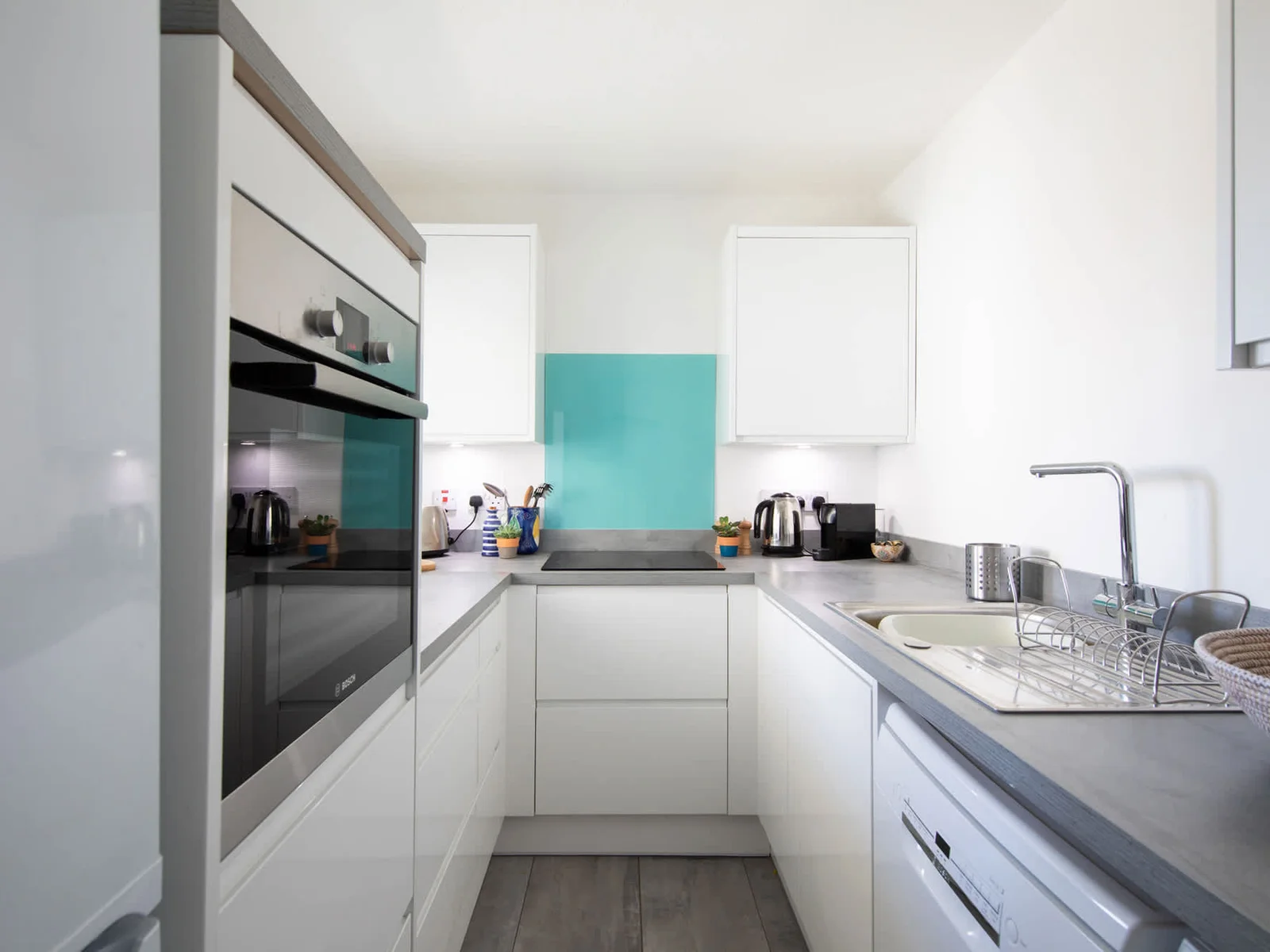 Every inch of space is well-used to provide you with this modern, fully equipped kitchen