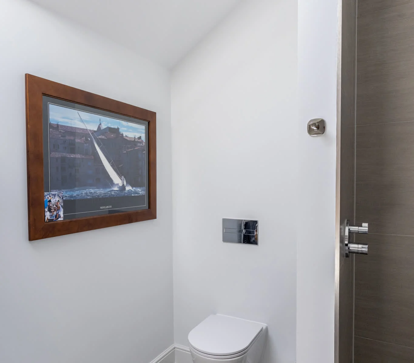 Stylish WC with skylight and modern fittings, adding convenience to the upper floor.