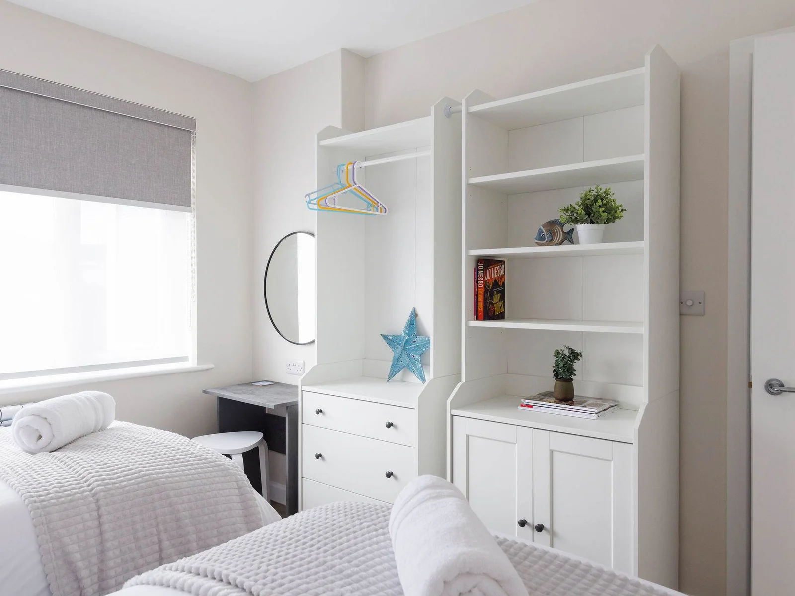 This room has lots of storage space and a small vanity desk.