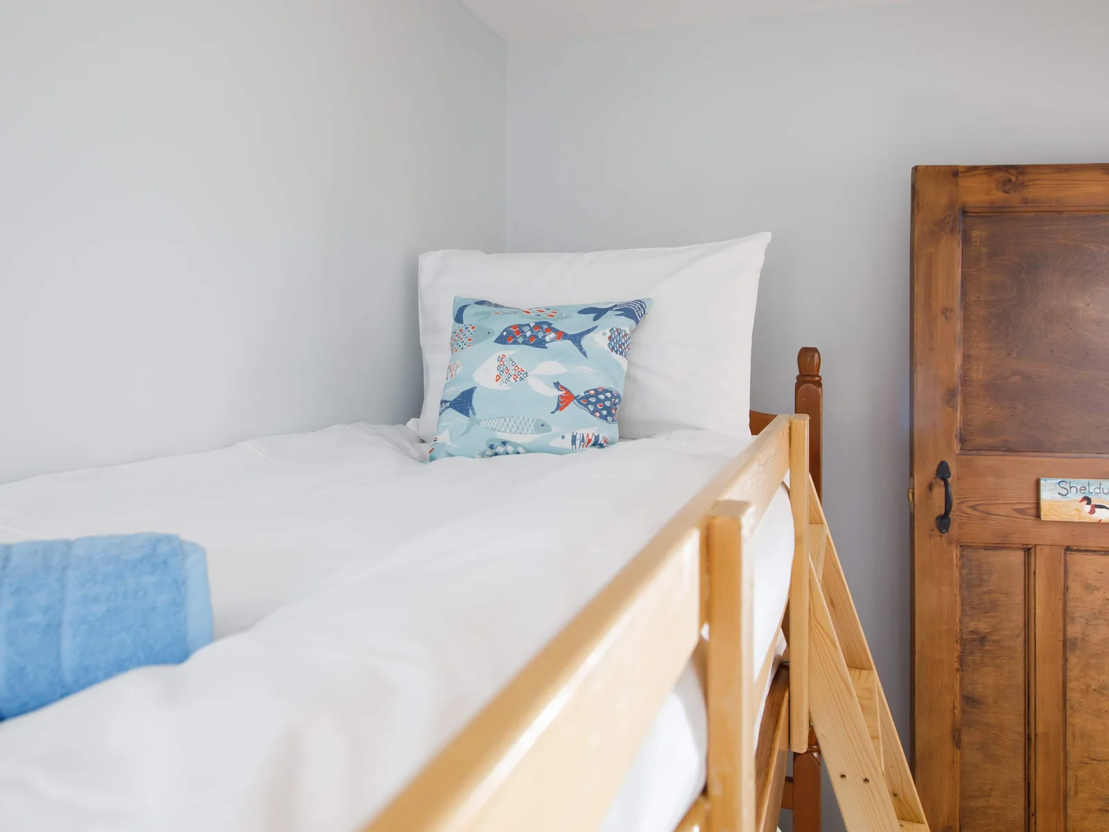 Which child is going to occupy the top bunk?