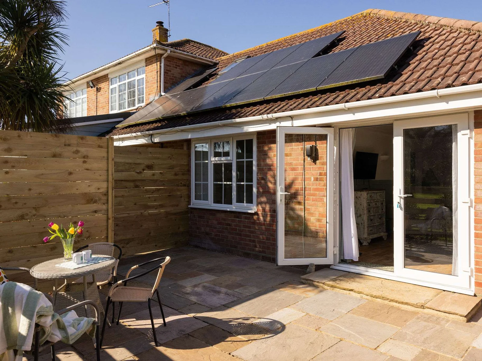Private outdoor space adds a sunny spot to relax between coastal outings and quiet evenings in.