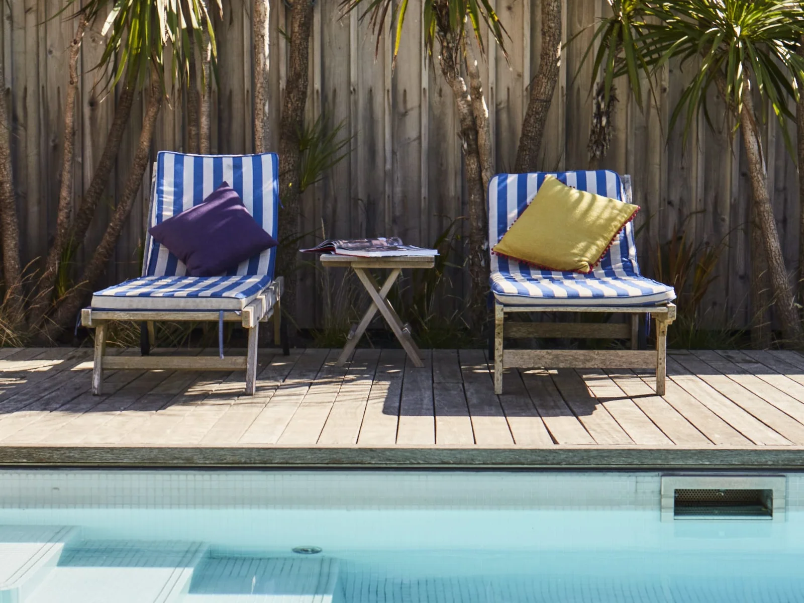 Enjoy a refreshing dip in our private swimming pool, surrounded by lush greenery