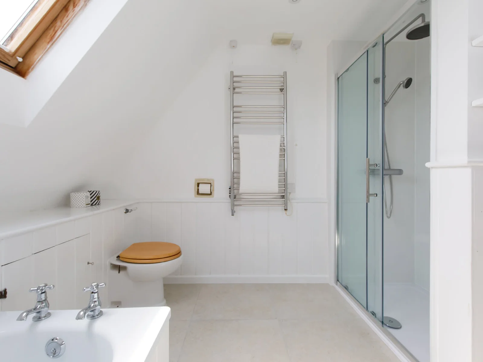 There is a bath and large separate, walk-in shower.