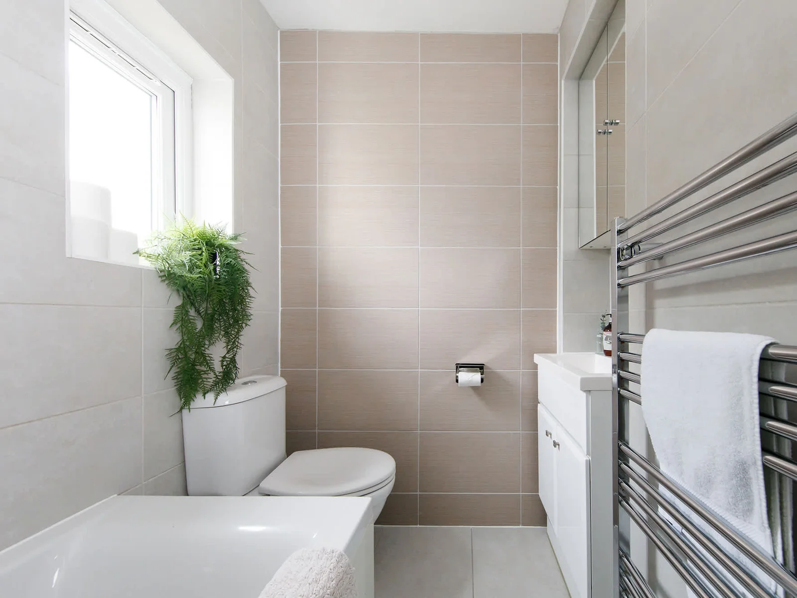 A family bathroom has towels and toiletries for all guests.