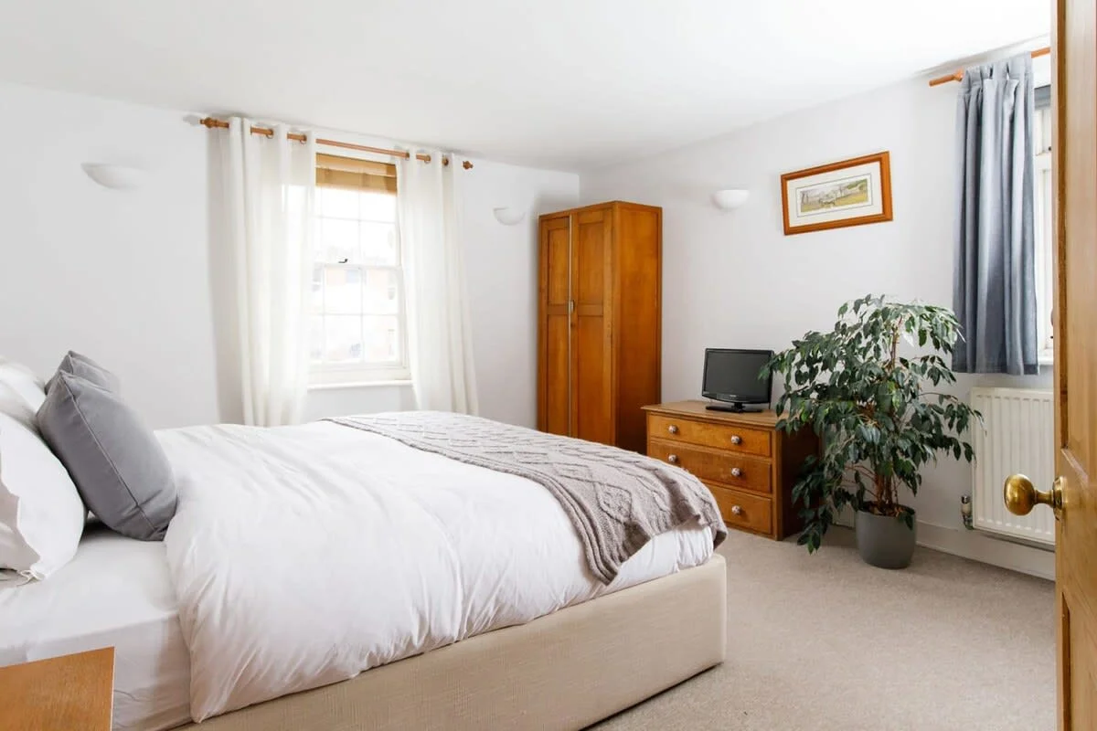 There are four bedrooms over three floors, all designed with comfort in mind (pictured: superking bedroom on first floor).