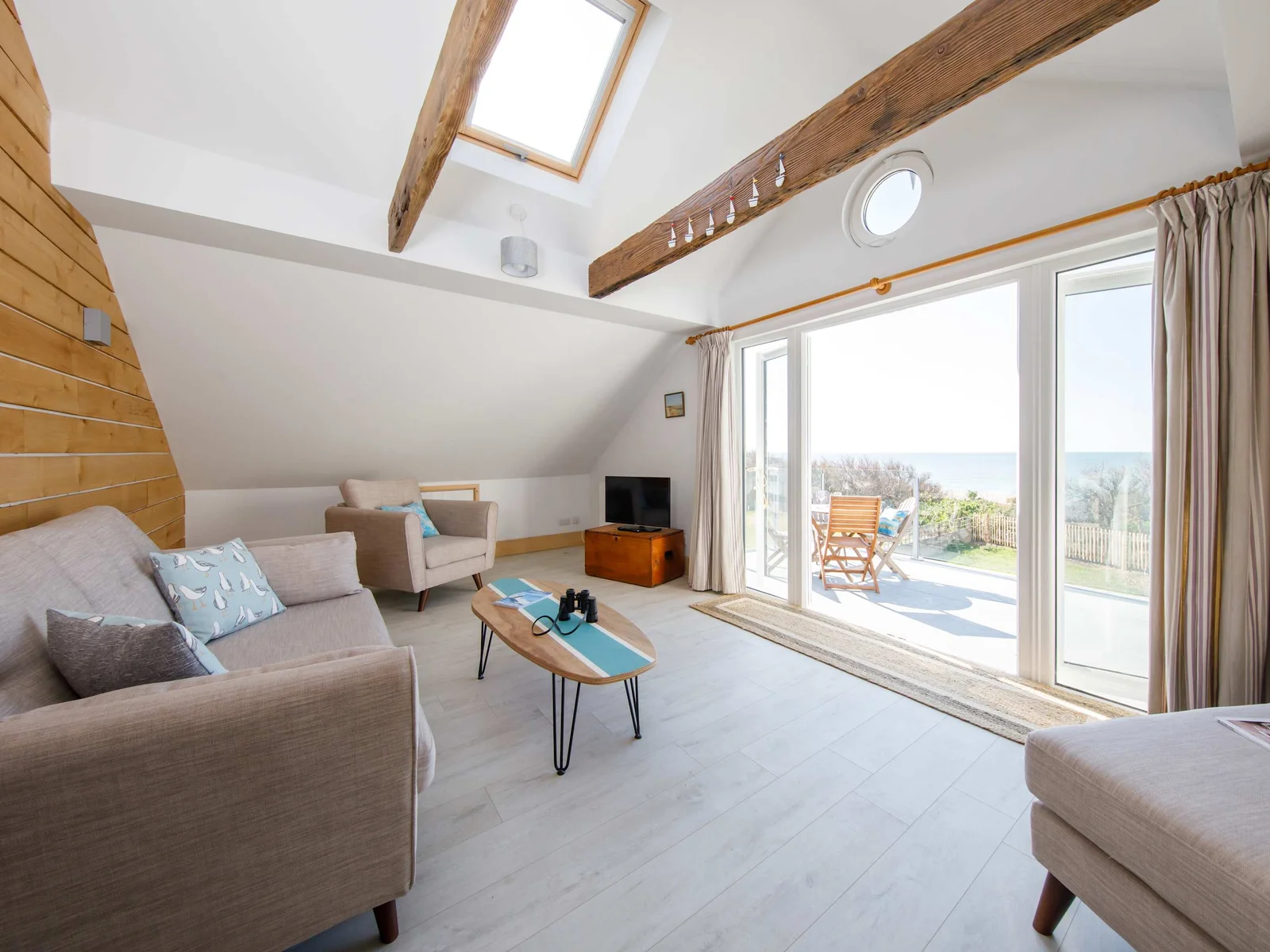 1st-floor living room offers a comfortable area from which you can gaze directly at sea