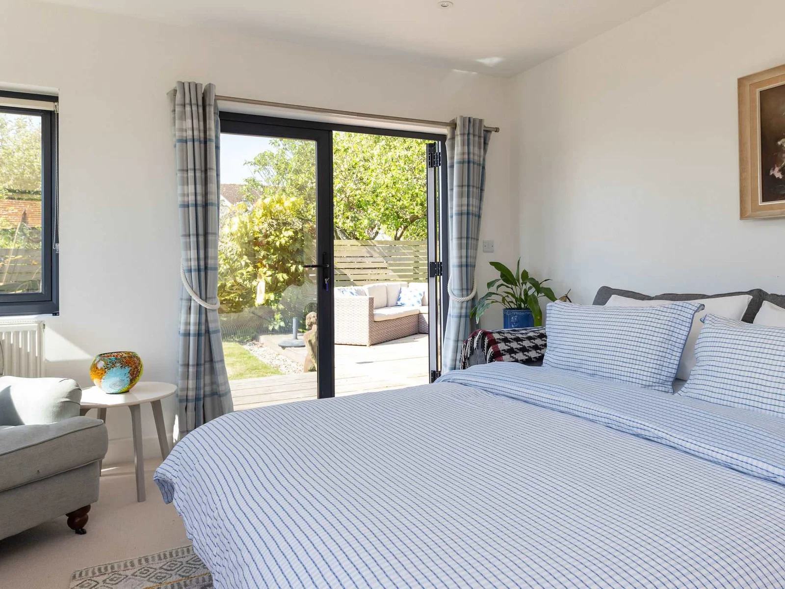 The living room transforms into a second bedroom with a comfy double sofa bed.