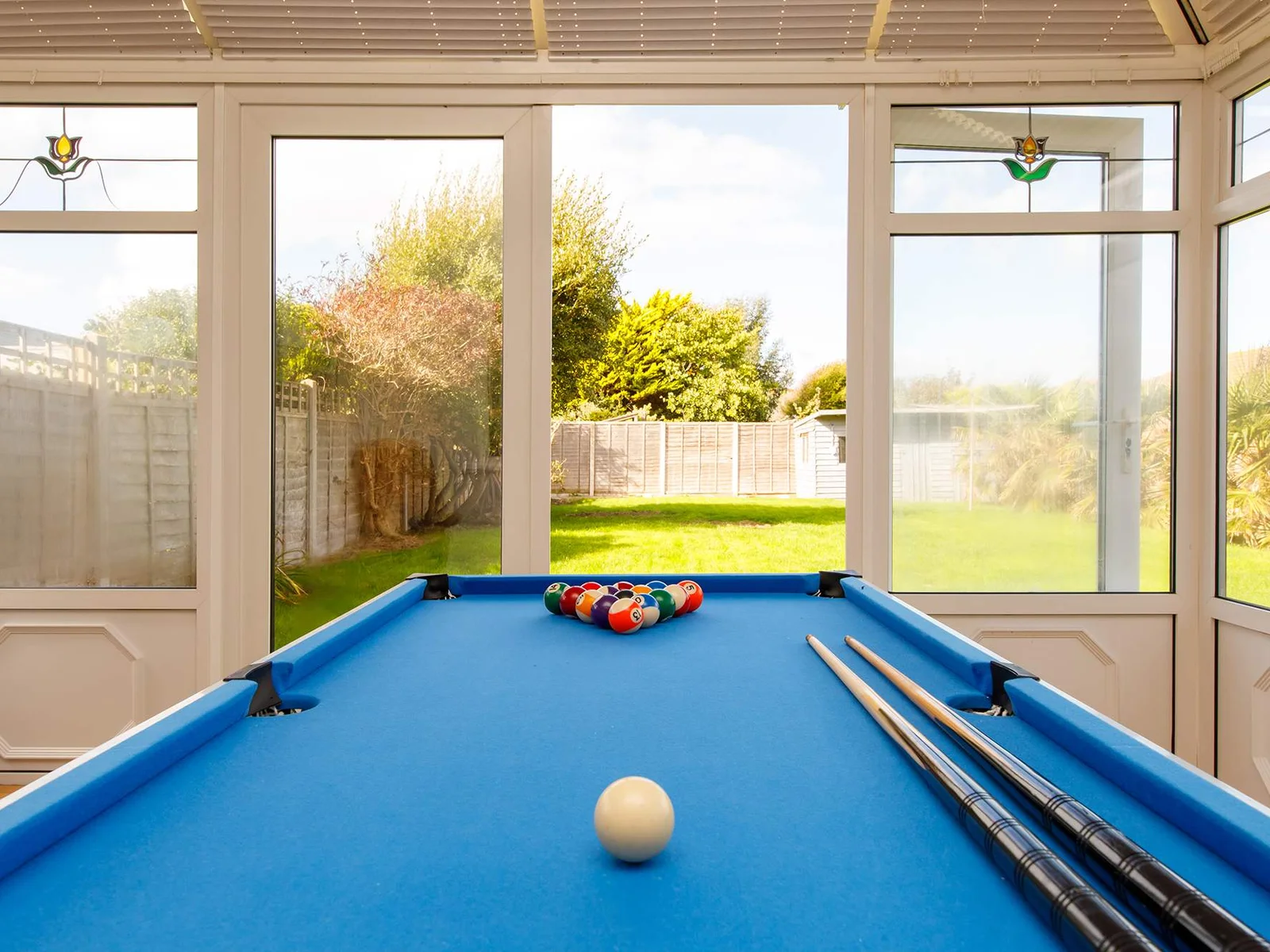 Rainy day? No problem! The conservatory has a pool table that converts into air hockey to keep everyone entertained.