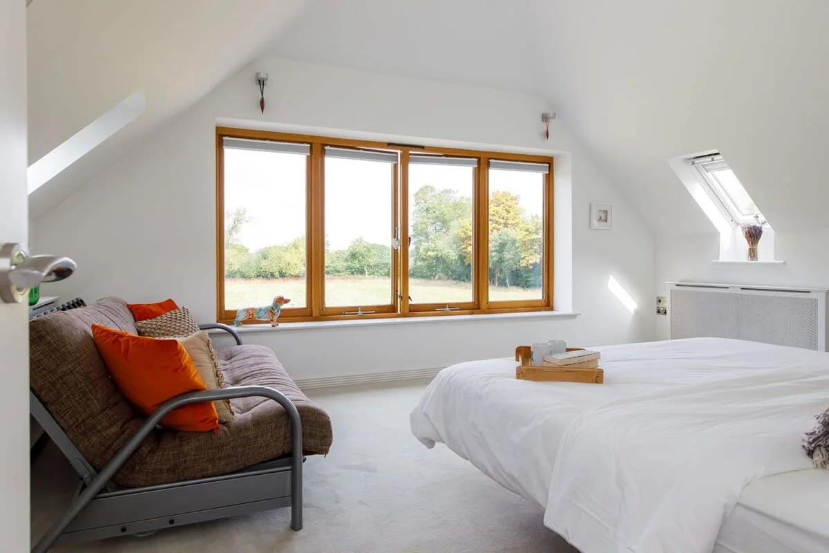 The large central window is a main focus of the room offering amazing views across the garden and allowing plenty of light in.