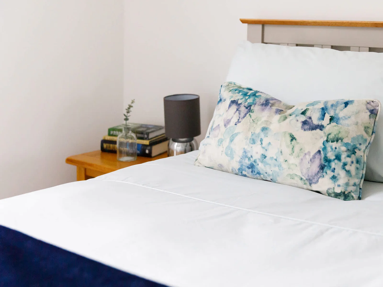 Bedside tables with lamps are found in each bedroom.