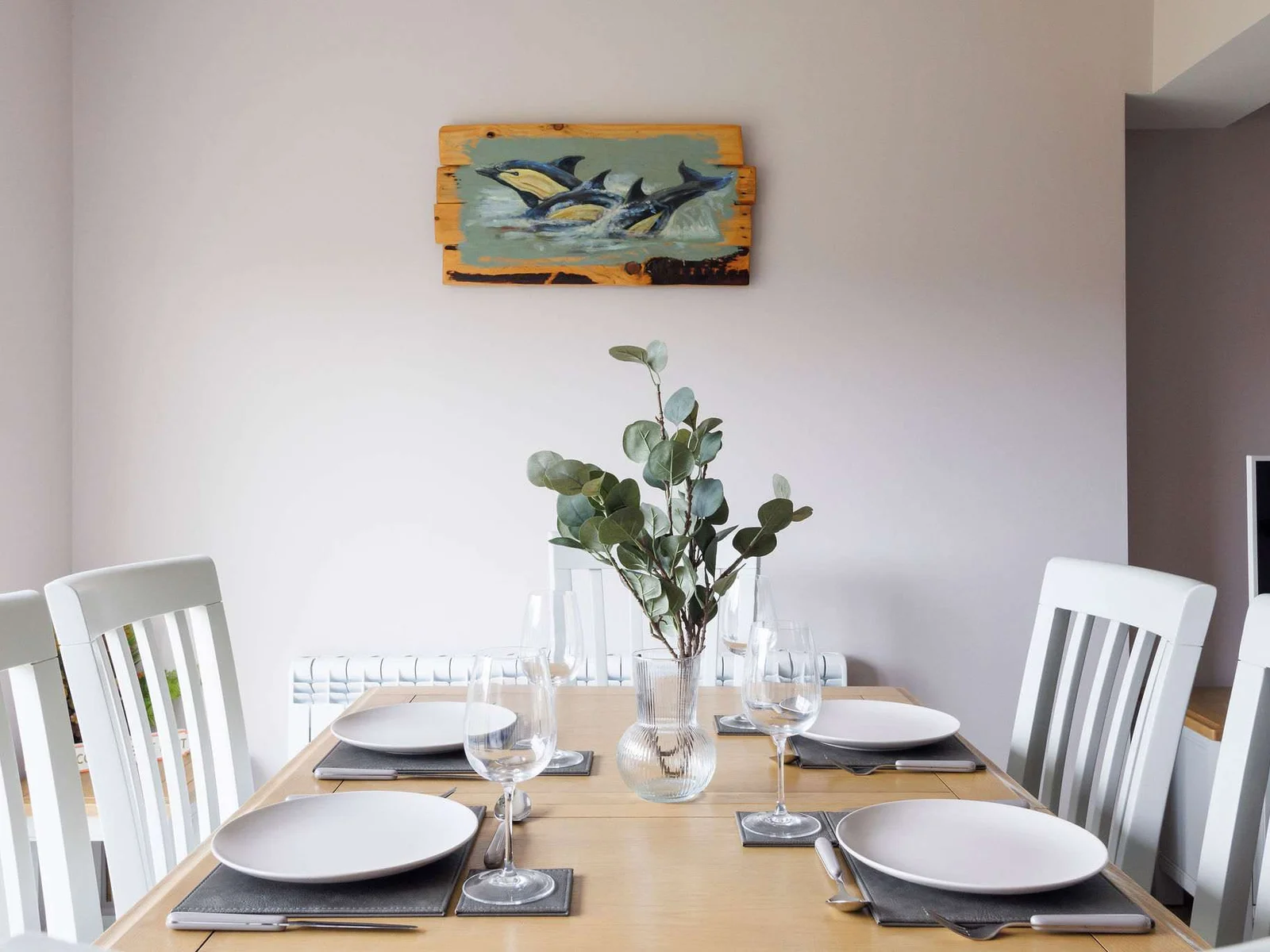 The dining area has table and chairs to seat up to 6 guests.
