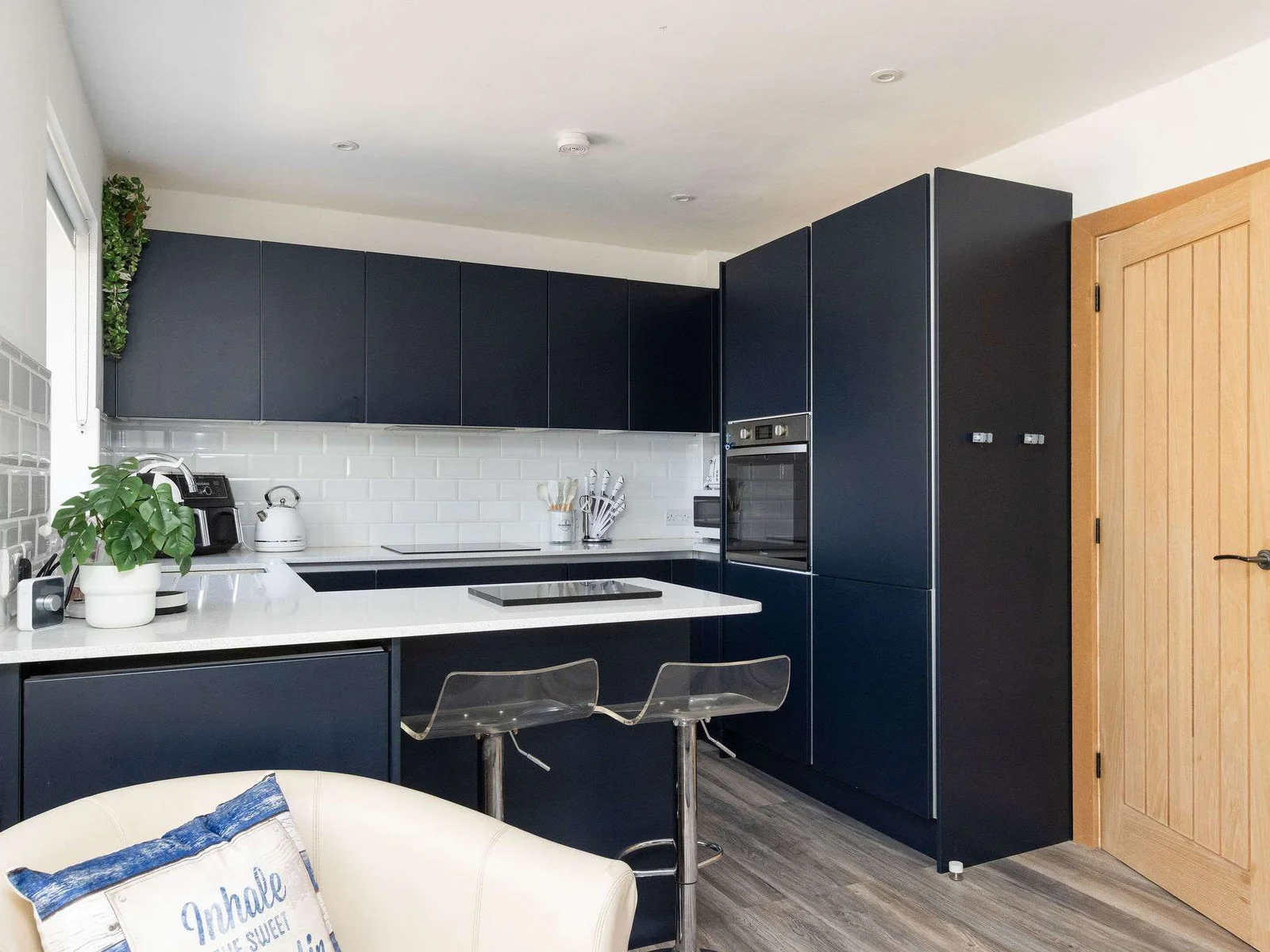 Sleek, modern kitchen with island seating