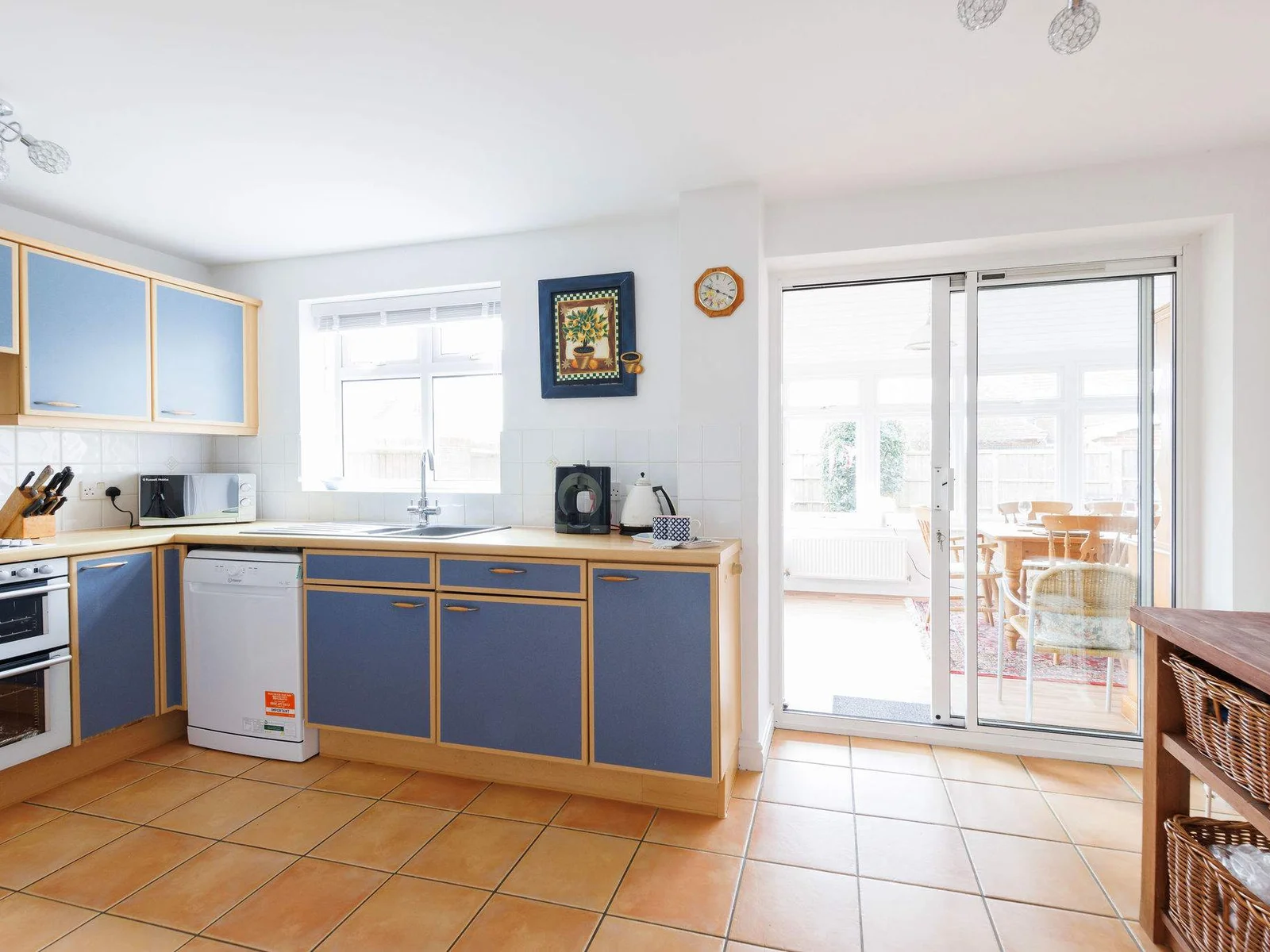 The kitchen is spacious with plenty of worktop space and cupboard storage.