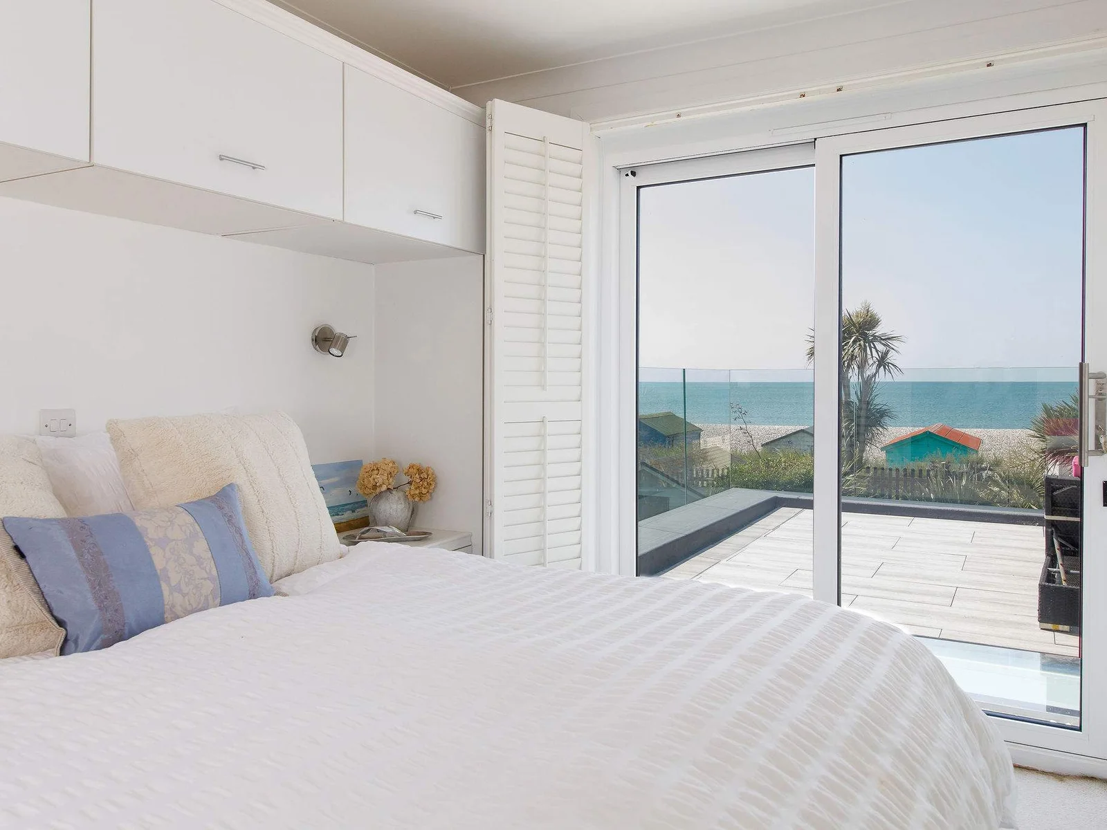 Two of the bedrooms have balcony access and magnificent sea views.