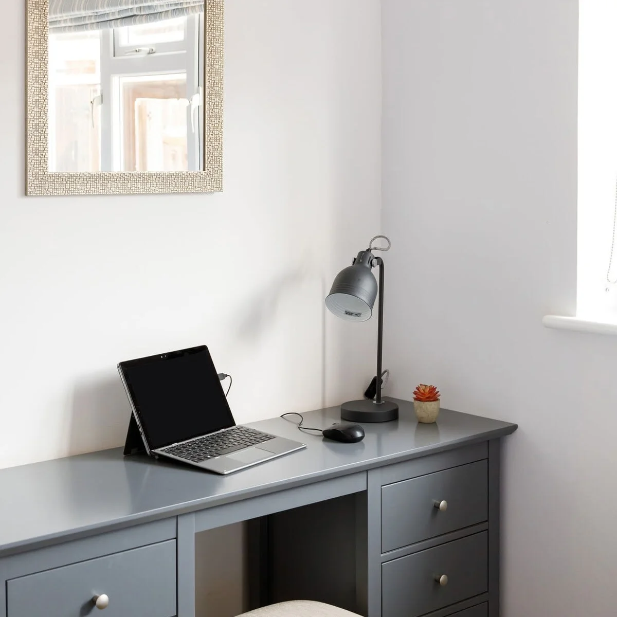A vanity desk with drawers for all your personal belongings.