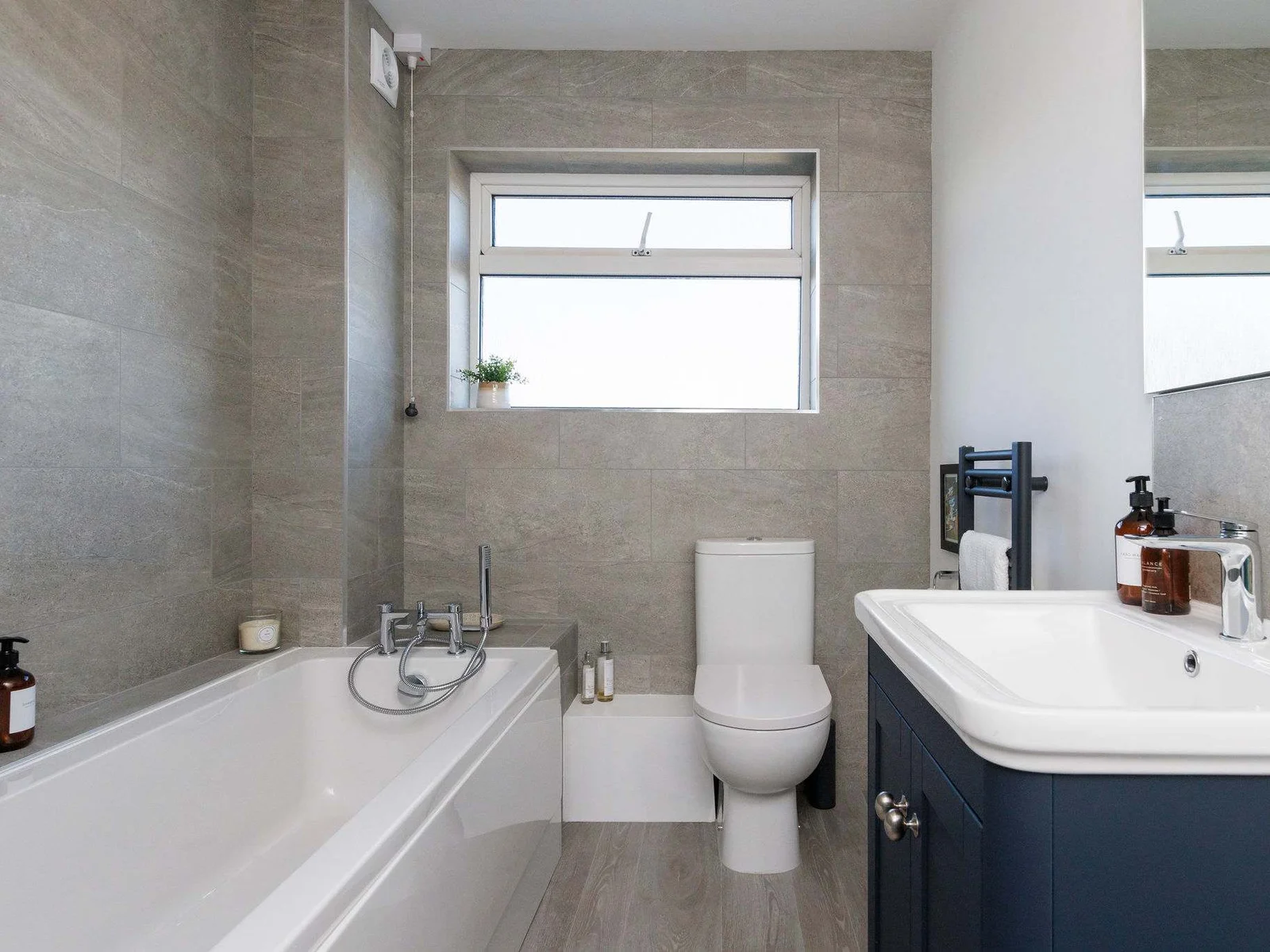 Modern bathroom with a sleek design and full amenities.