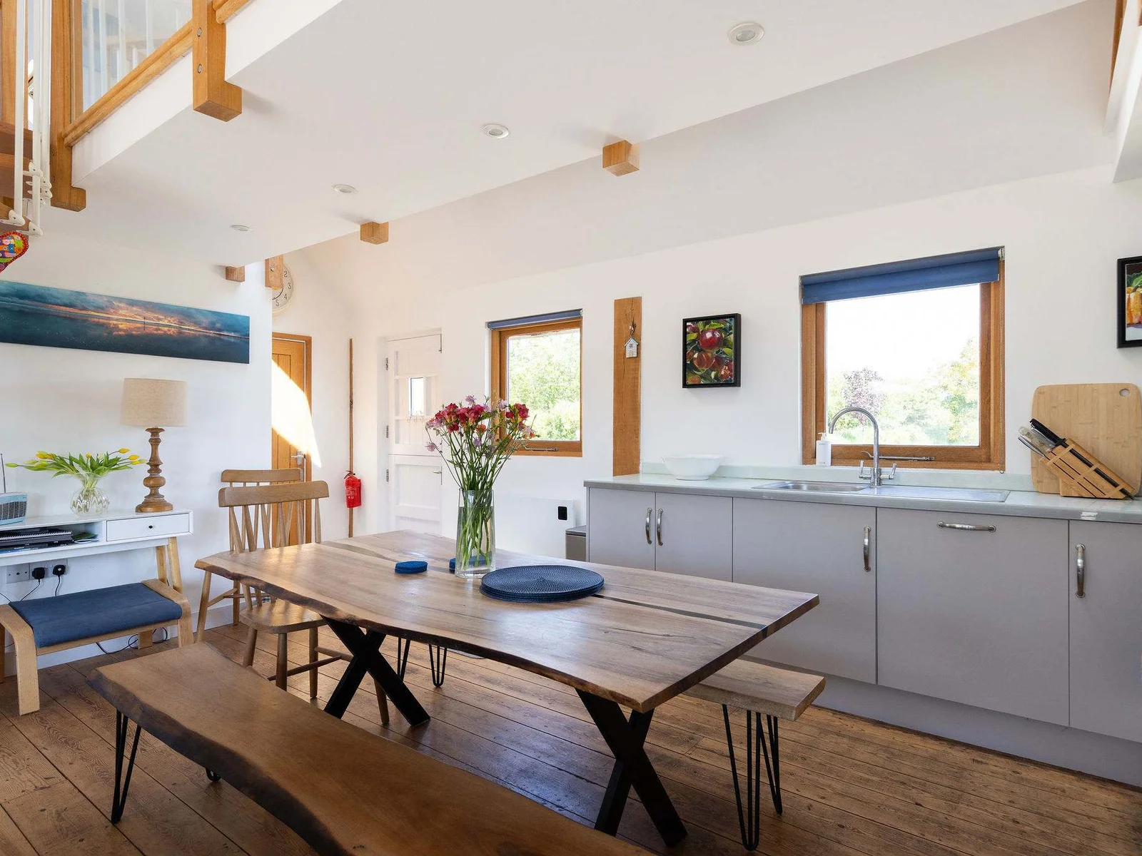 Enjoy shared meals and catching up with loved ones in this stylish, open-plan kitchen and dining area.