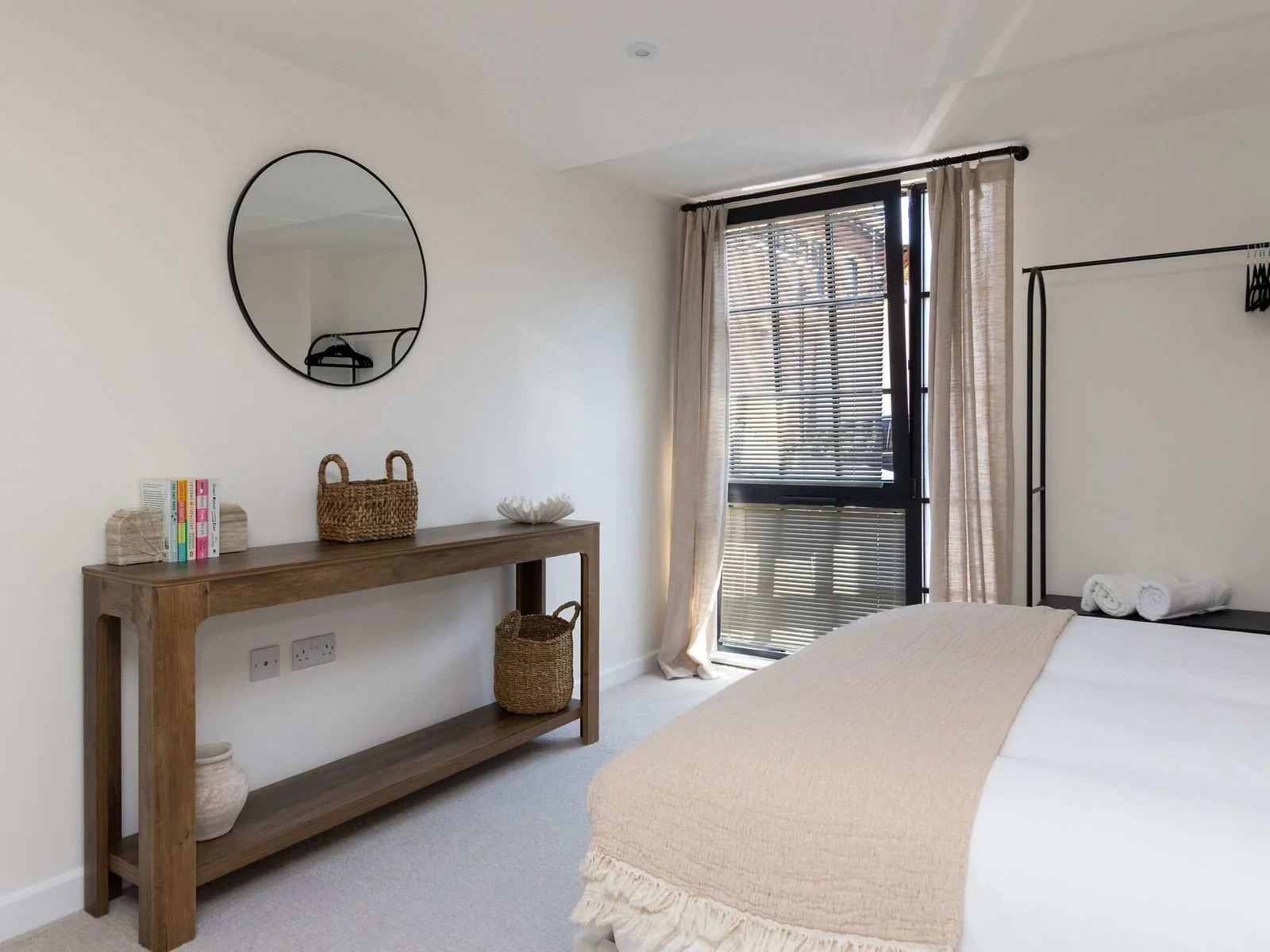 Bright and spacious king bedroom with stylish furnishings, perfect for a relaxing city break.
