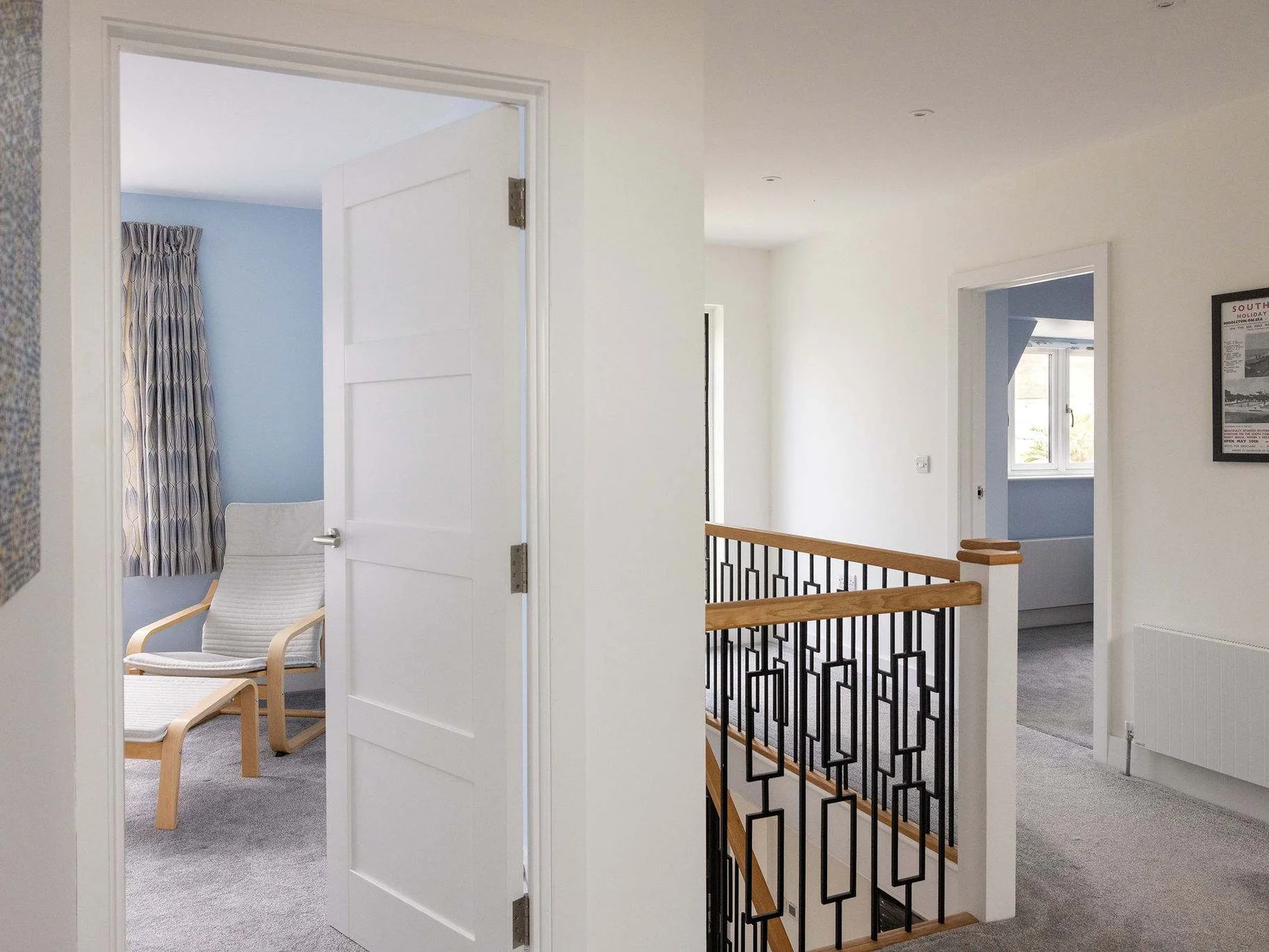 A bright landing leading to restful coastal bedrooms