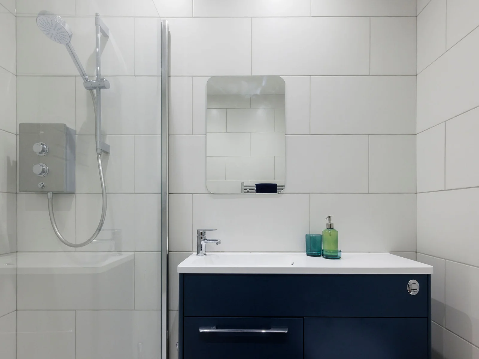 The apartment has a compact but functional bathroom.