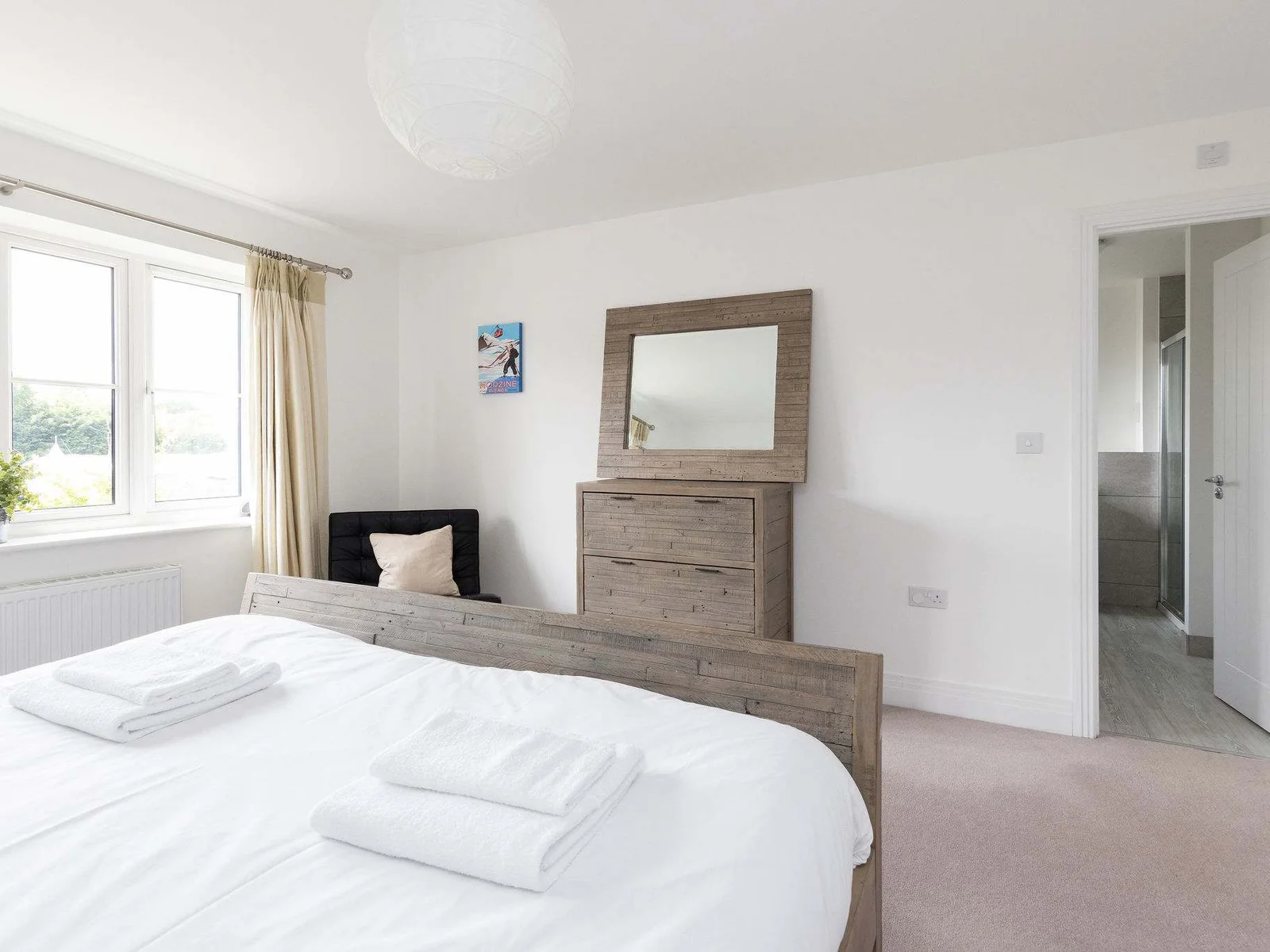 This bright and spacious room includes ample storage and the convenience of a private en-suite bathroom, just steps away.