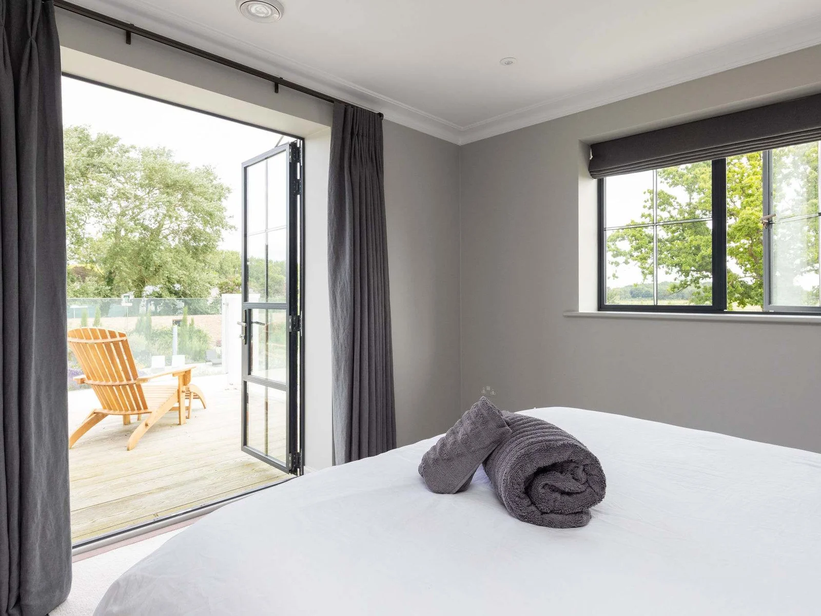 Bedroom 4 with open doors to terrace