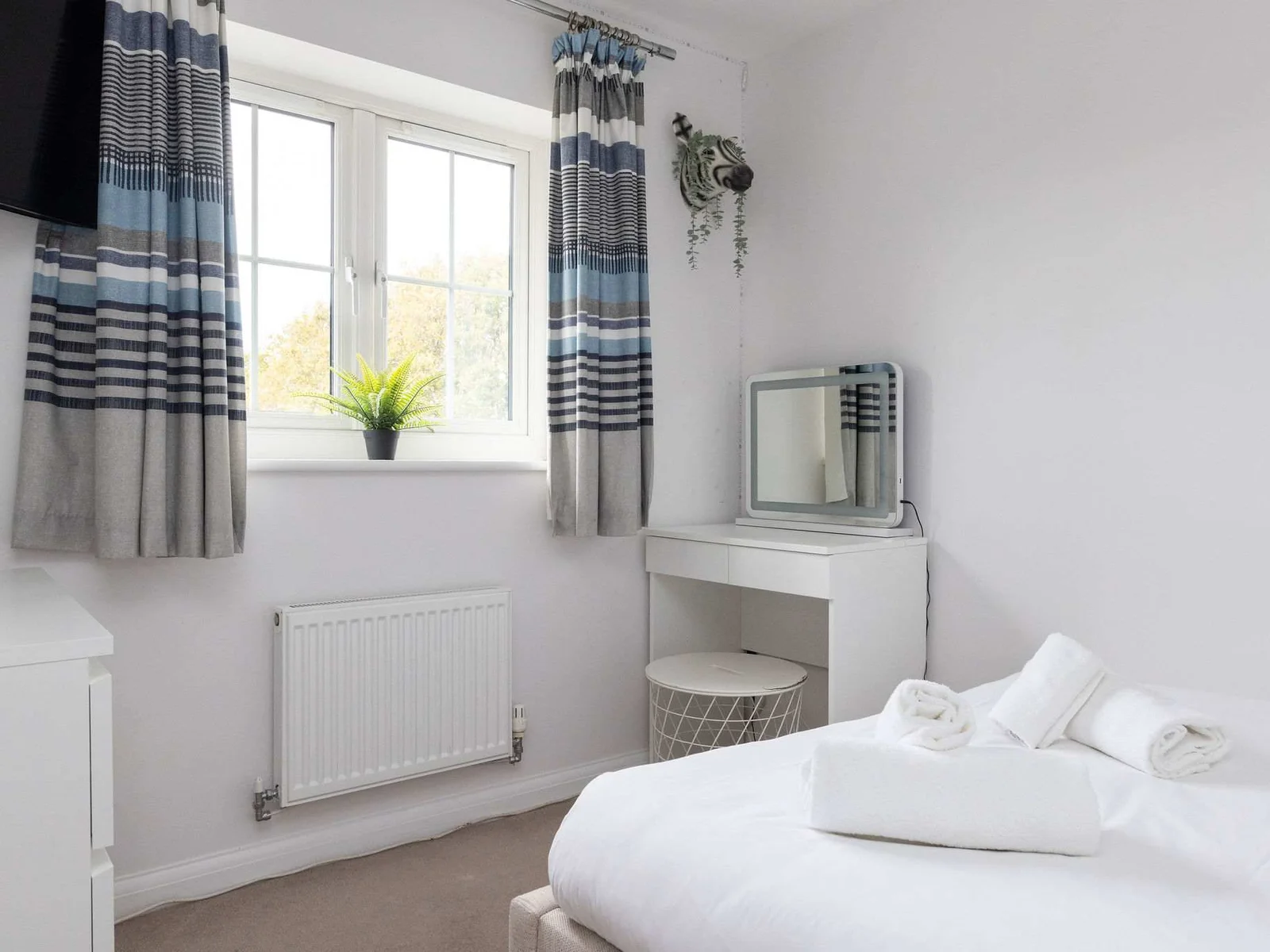 Bright vanity area in a double bedroom.